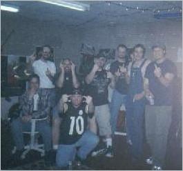 Looney Bin Official Members-left to right are Don, 
Kevin (standing), Scott, Orphan (#10), Mike B., Johnboy (+hair), Chad 
(overalls) and Joonya! Dave D. (not pictured). Picture taken by Mandah Foster.